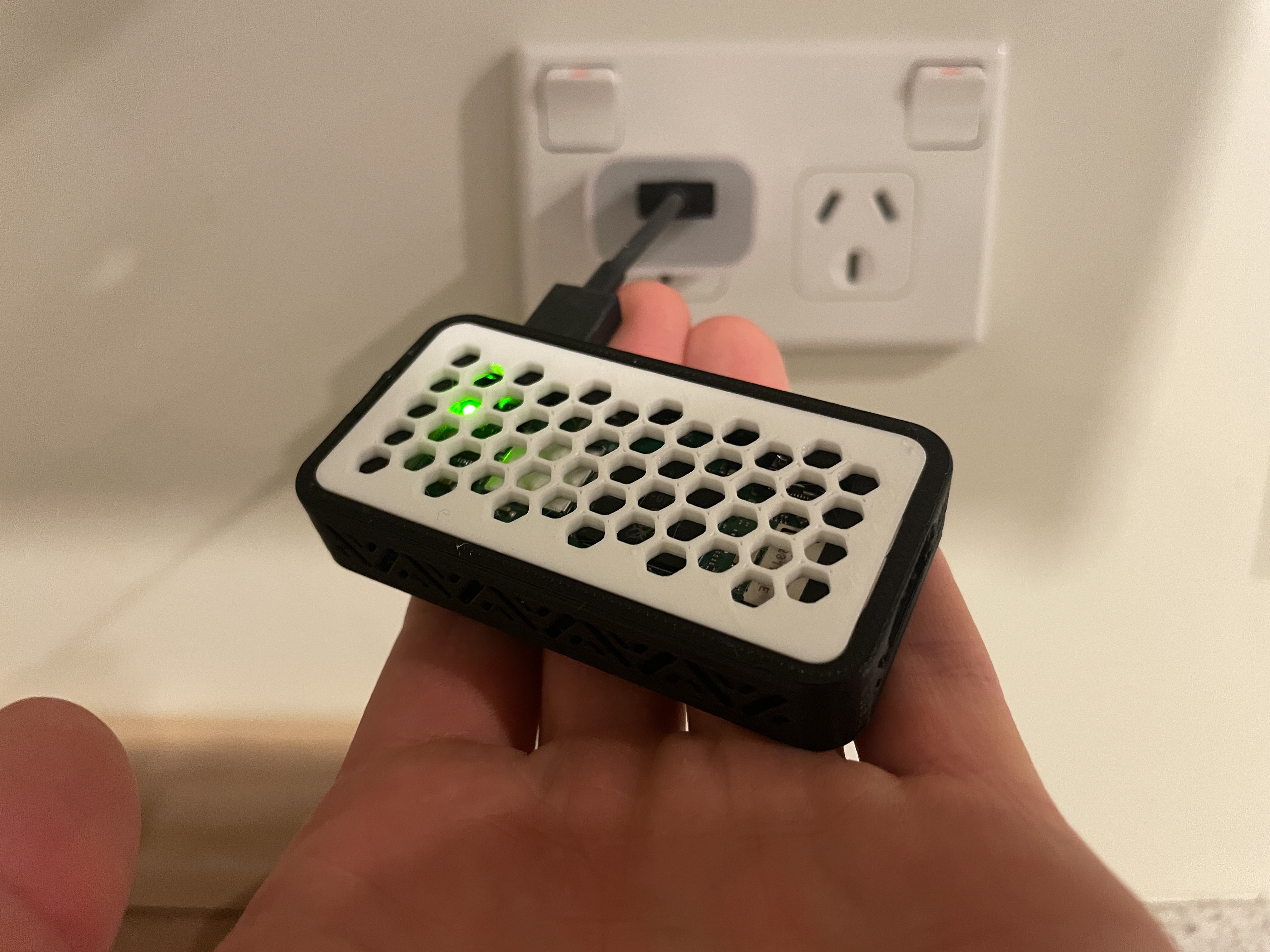 The teeny tiny Raspberry Pi Zero 2W in its 3D printed case.